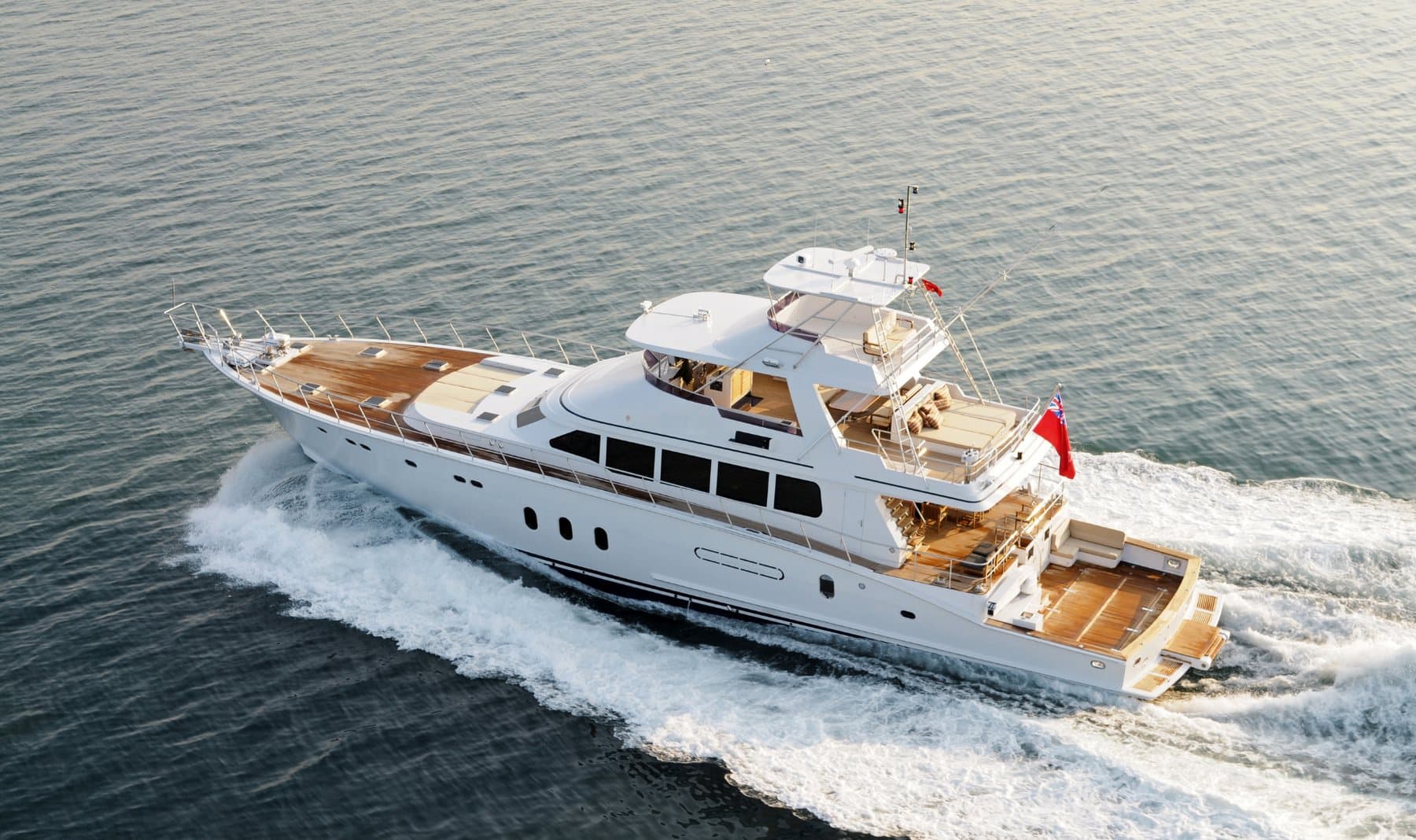 White motor yacht under way, seen from above